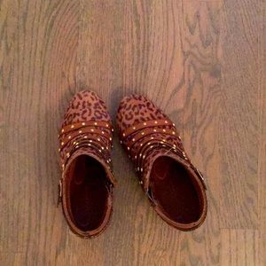 Cheetah print boot, with three belts.